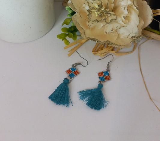 Boucle d'oreille pompon