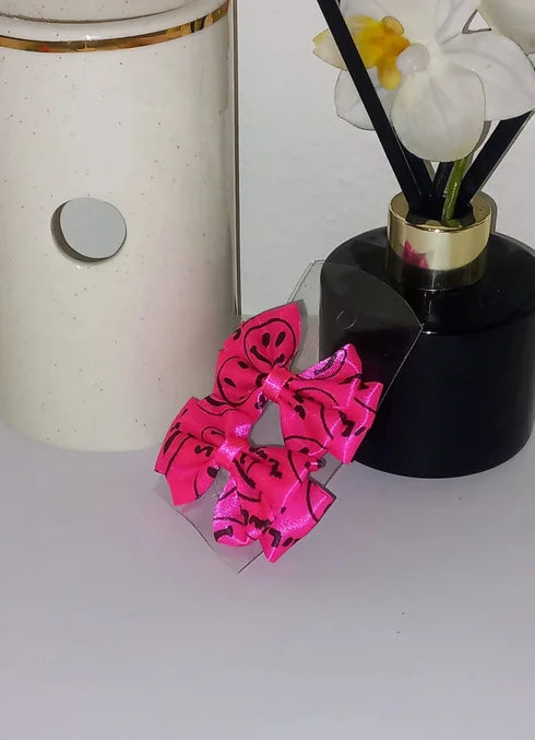 Neon pink bow clip